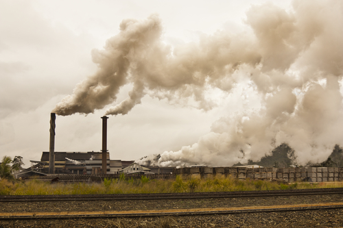 smog and pollution coming from a sugar mill 